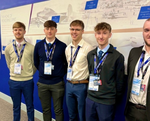 six young men standing against a graphic background